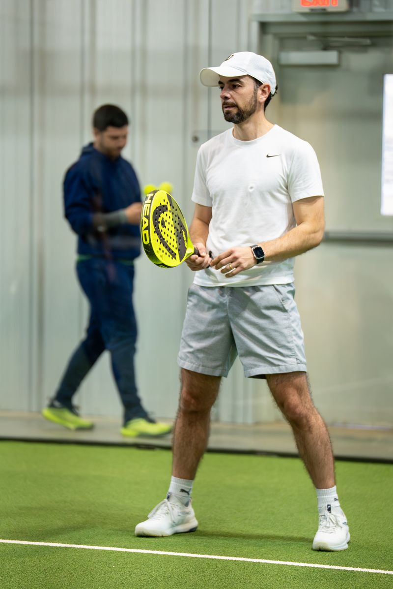 Player with racket at Access Padel