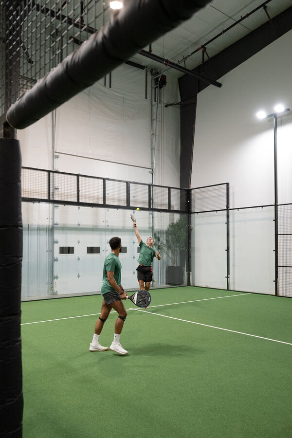 Doubles serve at Access Padel