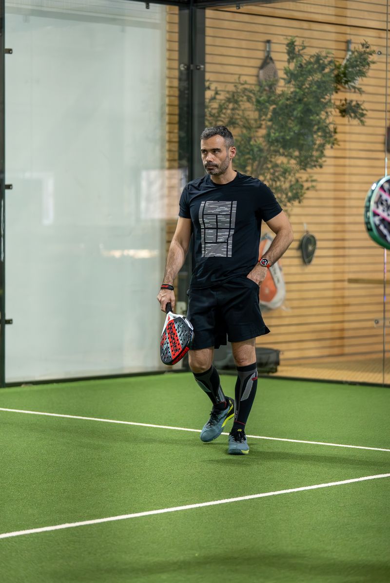 Player walking on premium court at Access Padel